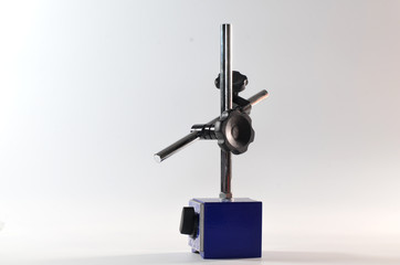 The magnetic base stands on a white background inside