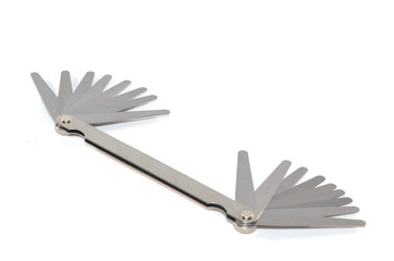 Stainless steel double end feeler gauge on white background