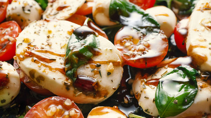 Caprese. Italian mozzarella salad, tomato and basil. Macro shot