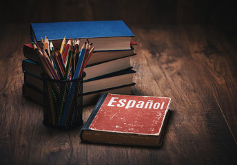 learn Spanish. Book on a wooden table