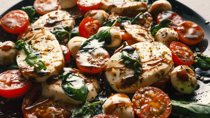 Caprese. Italian mozzarella salad, tomato and basil. Macro shot