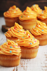 Cupcakes with orange icing on top