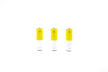 A lot of stylish yellow AA batteries on a white background isolate