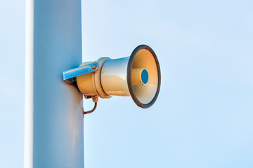 Street loudspeaker megaphone mounted on the post