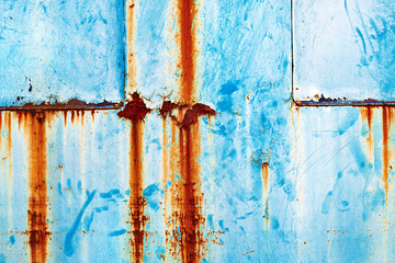 Grunge rusty metal surface painted in blue