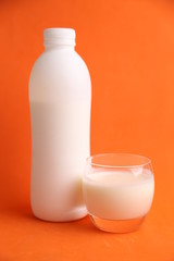 liquid yogurt bottle in color background