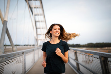 Sport, health, lifestyle and exercise concept. Sporty fit woman running.