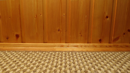 Fototapeta na wymiar wooden wall carpet wooden skirting board 