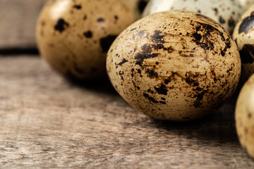 Quail eggs on a wooden table