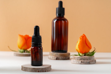 Cosmetics containers decorated with orange rose petals