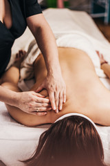 Obraz na płótnie Canvas Cervical collar massage to relieve pain and improve blood circulation - back massage