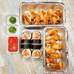 Sushi set, delivery of sushi in plastic boxes.