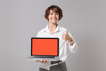 Funny business woman in white shirt posing isolated on grey background. Achievement career wealth...