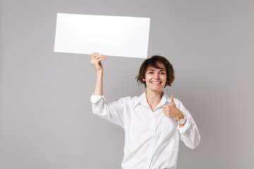 Smiling business woman in white shirt isolated on grey background. Achievement career wealth...