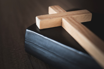 The crucifix lay on the bible. It is a blessing from God with the power and power of holiness, which brings luck and shows forgiveness with the power of religion, faith, worship.