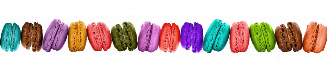 Row of colorful macarons isolated on panoramic white background
