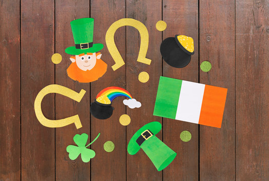 holidays and celebration concept - st patrick's day decorations or party props made of paper on white background