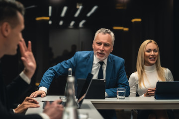 The people talking to each other on business conference