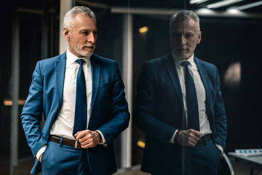 The handsome businessman standing indoor