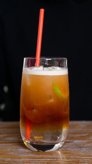 Nitro cold brew coffee with slice of lime and ice