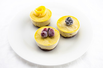 Frozen Berries and Fresh mango on top of mango raw cake