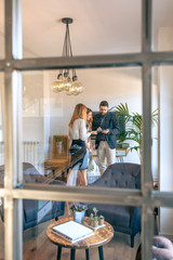 Business people having an informal work meeting seen through the glass