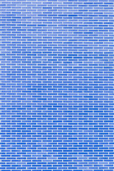 real wall made of solid blue bricks, in vertical plane