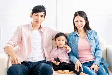 happy family watching the tv  on sofa