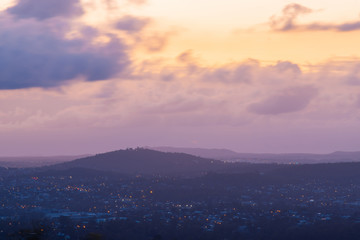 Dawn view of suburbs and mountain on the background at Brisbane, Australia.