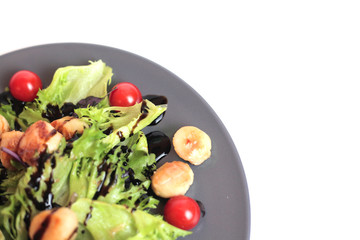 Seafoods - Shrimps, Sea Scallops, Squids and Salmon. Garnished with Fresh Raw Salad Leaf.
