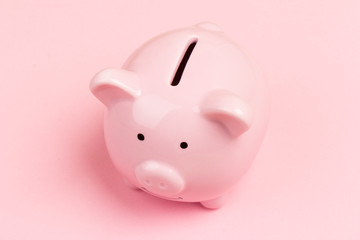 pink ceramic piggy Bank isolated on pink background