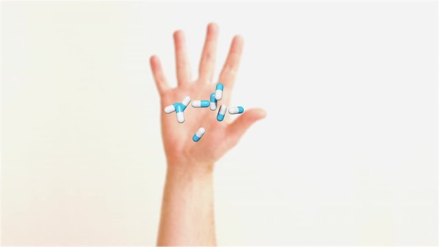 hand throwing medicine in the trash