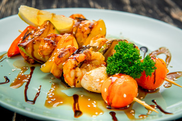 Shrimp and vegetable skewer on grill closeup