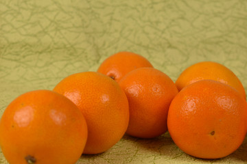 fresh tangerines on a green background