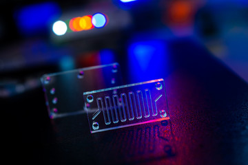 microfluidic device Instrument that uses micro amounts of fluid on a microchip to do certain...