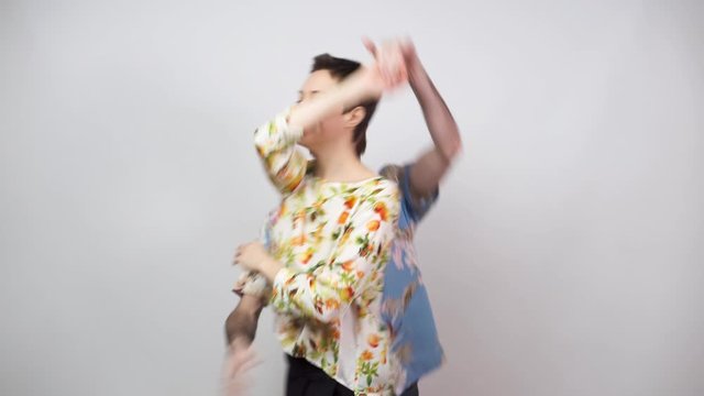 Swing dancers wearing hawaiian shirts on white background. Man and woman are dancing boogie woogie dance. Happy couple dancing. Social dance concept.