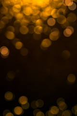 Abstract golden and black backdrop with bokeh