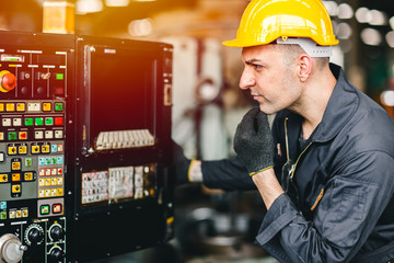 factory worker man operate the machine, high skill labor work industry with safety clothes.