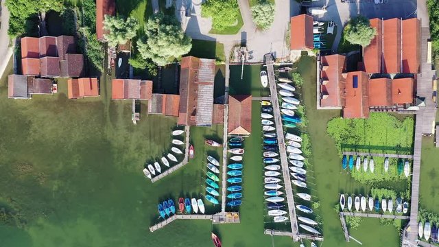 Aerial of boat houses at and jetties at lake Ammer, Bavaria, Germany