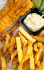 Street food. Breaded cod fillet with french fries.