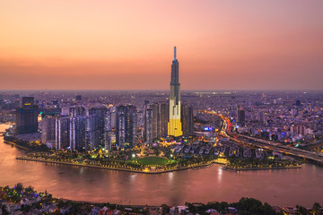 Top view aerial of center Ho Chi Minh City and Saigon bridge with development buildings,...