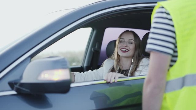 Business woman speaks with man in uniform and rejoices