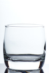 set of glass empty glasses and goblets on a gray-white background