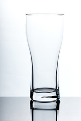 set of glass empty glasses and goblets on a gray-white background