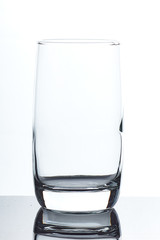 set of glass empty glasses and goblets on a gray-white background
