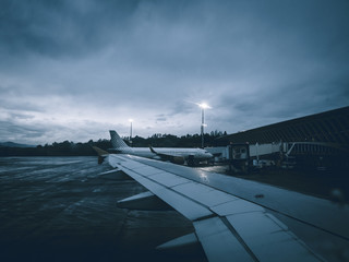 Fototapeta na wymiar Air plane in bad weather at an airport