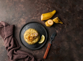 Mofongo, mashed  boiled plantains with porc meat, onion. Puerto Rico.  Amazonian cuisine, Peru,...