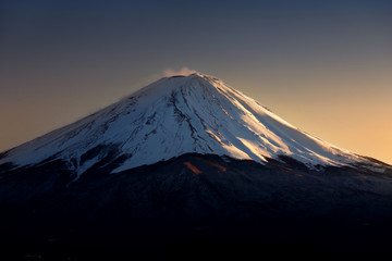 close-up top of Mountain Fuji with snow in the evening.