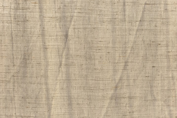 The texture of the natural old cotton fabric is exposed to sunlight.