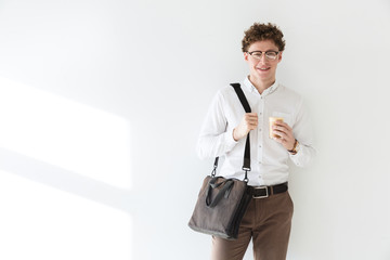 Handsome confident young curly haired businessman